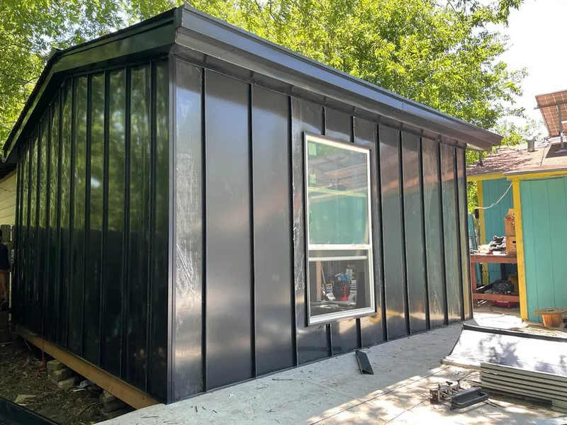 Black standing seam metal wall panels for Roof Inspection in Chaparral