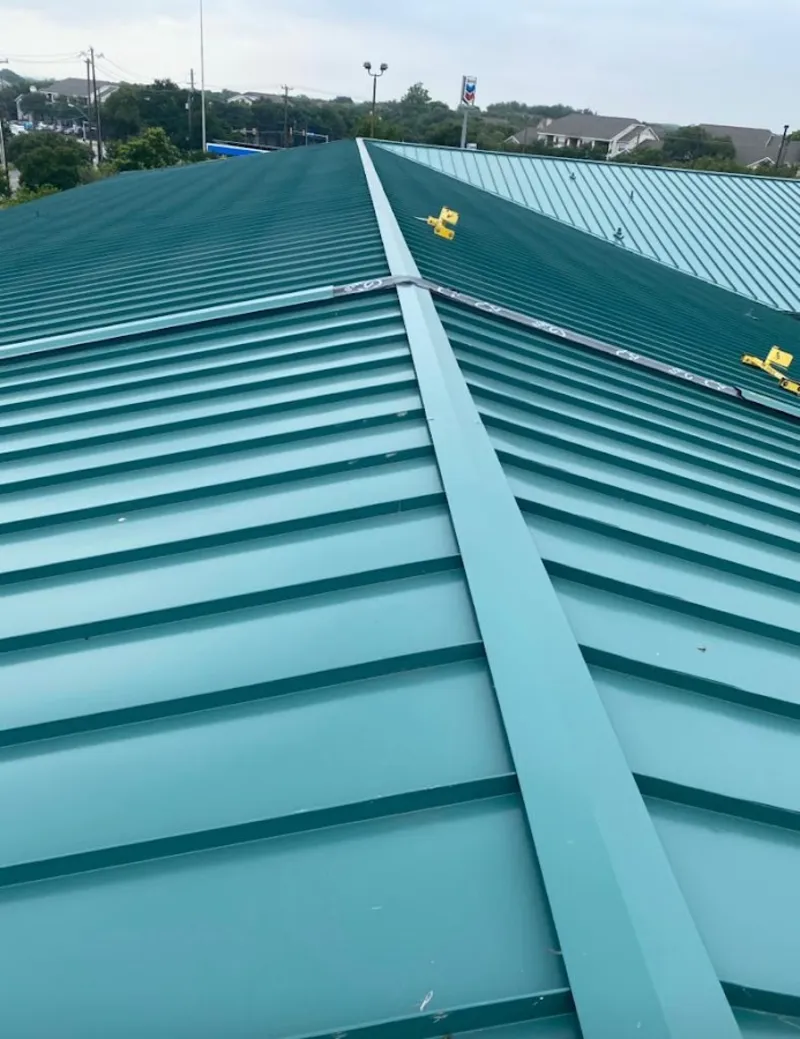 Green commercial metal roof ridge and valley for Metal Roof Repair in Chaparral